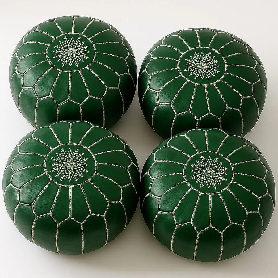 Four matching emerald green Moroccan leather poufs with intricate star top-stitching