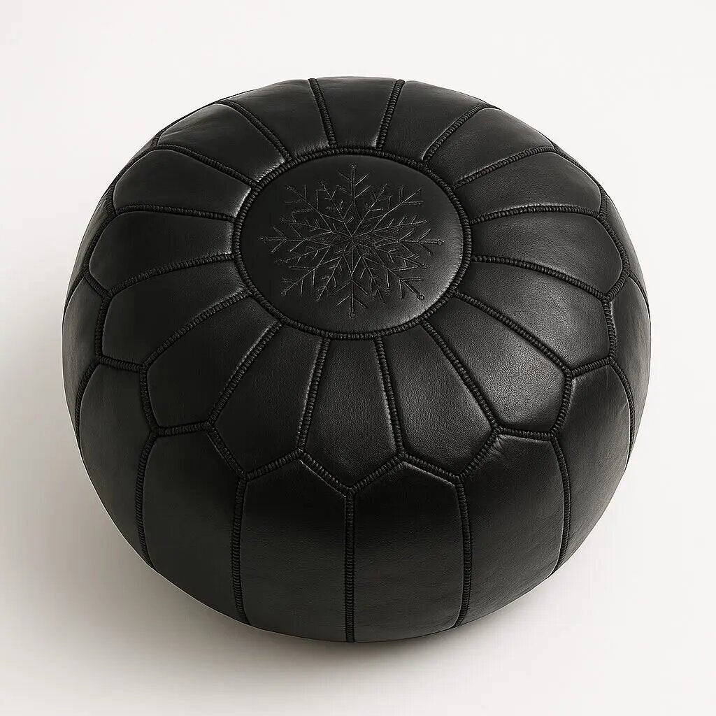 Black Moroccan leather round pouf with a tonal black embroidered star medallion on the top panel