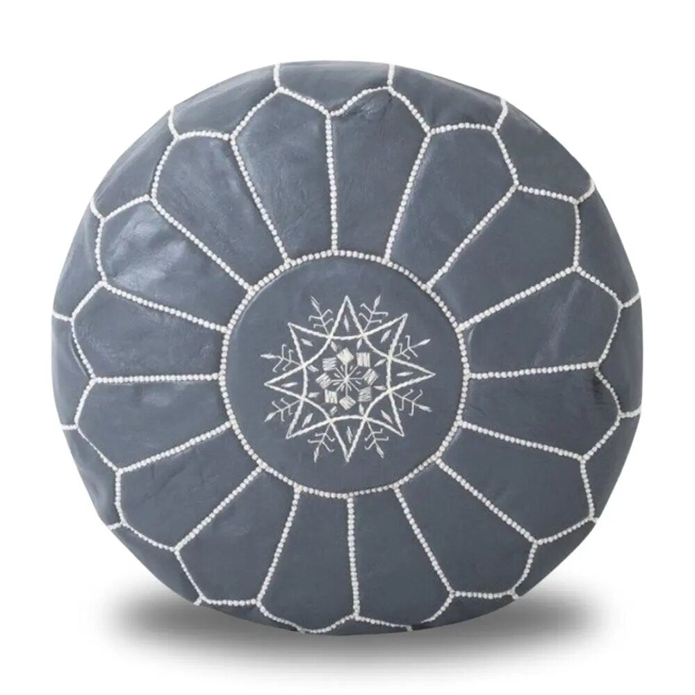 Round Moroccan leather pouf in slate gray with white hand-stitched panel seams