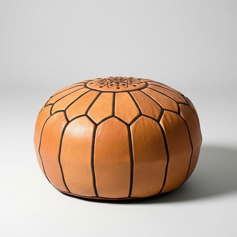 Light brown Moroccan leather round pouf with embroidered star medallion