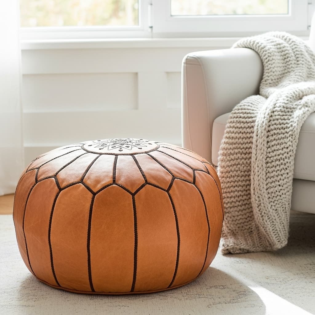 Tan leather round ottoman photographed from above