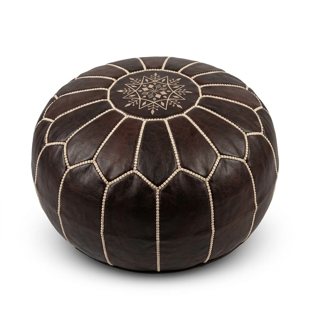 Dark brown Moroccan round leather pouf with hand-embroidered beige eight-pointed star on the top panel, on a plain white background