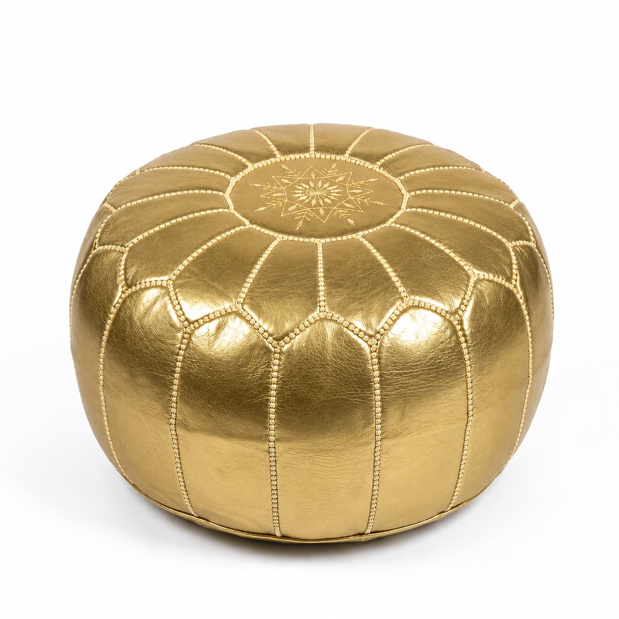 Champagne gold Moroccan round leather pouf with embossed eight-pointed star on the top panel, on a plain white background