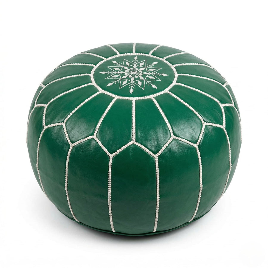 Green Moroccan round leather pouf with hand-embroidered white eight-pointed star on the top panel, on a plain white background