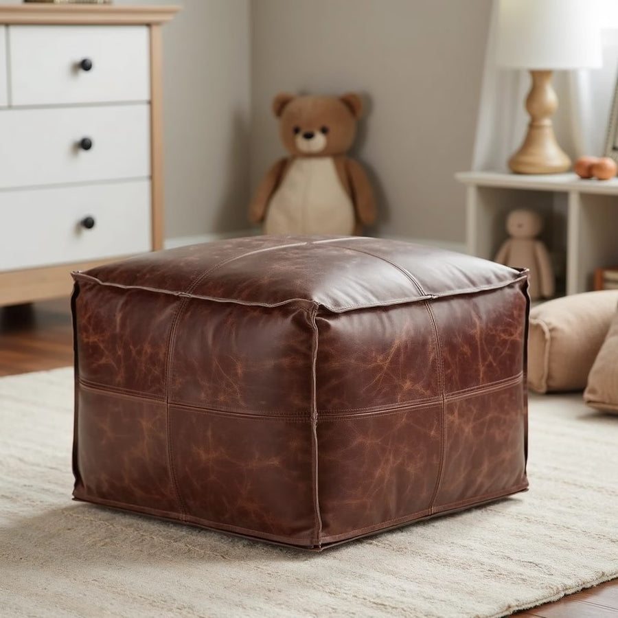 Tan square leather pouf with a serving tray in a modern living room