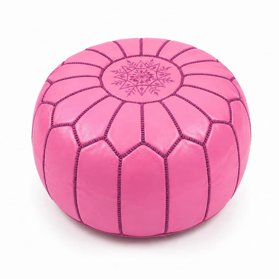 Pink Moroccan round leather ottoman with burgundy mandala embroidery, on a plain white background