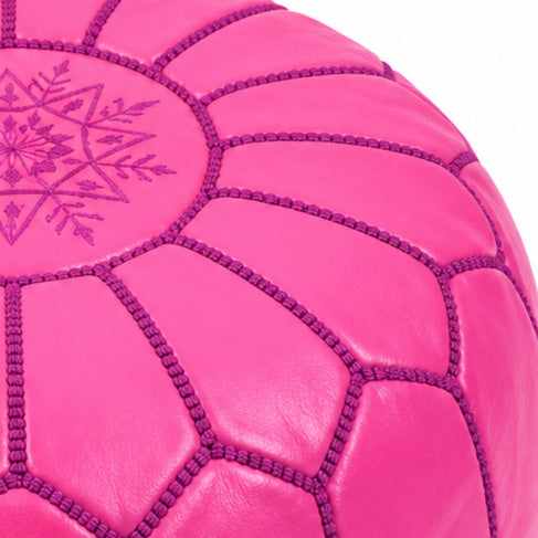 Close-up of the burgundy mandala embroidery and panel stitching on the pink pouf