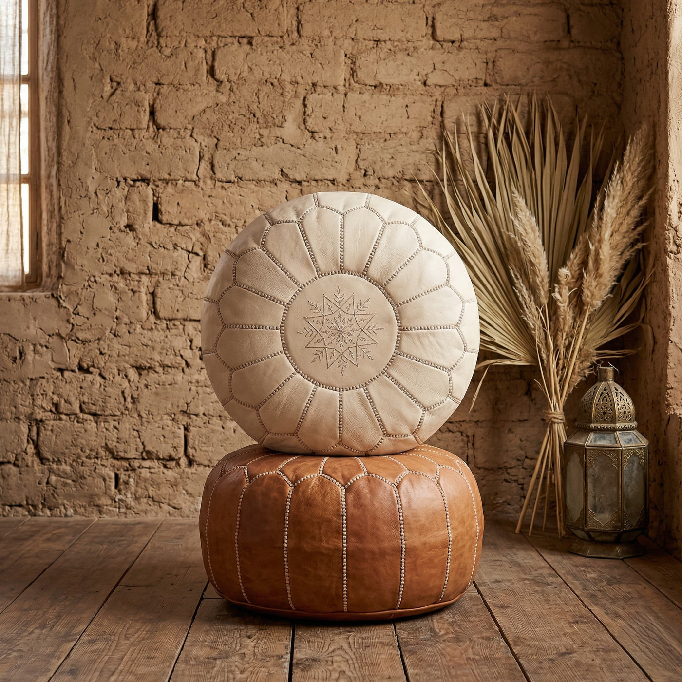 Undyed leather pouf in a styled living room setting
